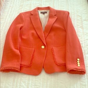 Coral blazer with gold buttons. Fringe trim.